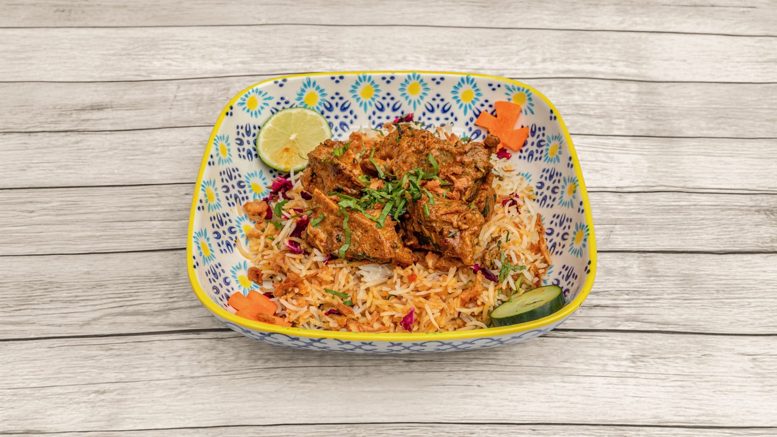Hyderabadi lamb dum biryani with saffron basmati rice, mint and fried onions