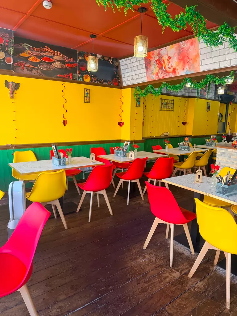 The dine-in room at Titu's Kitchen on Moulsham Street, Chelmsford, laid for service